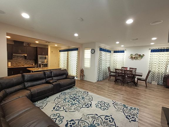 Capturing the heart of home - a panoramic view showcasing a spacious living room, dedicated dining space, and a modern kitchen. The perfect setting for shared moments and culinary delights. __________