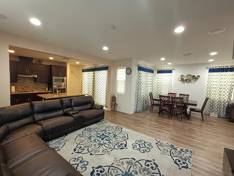 Capturing the heart of home - a panoramic view showcasing a spacious living room, dedicated dining space, and a modern kitchen. The perfect setting for shared moments and culinary delights. __________