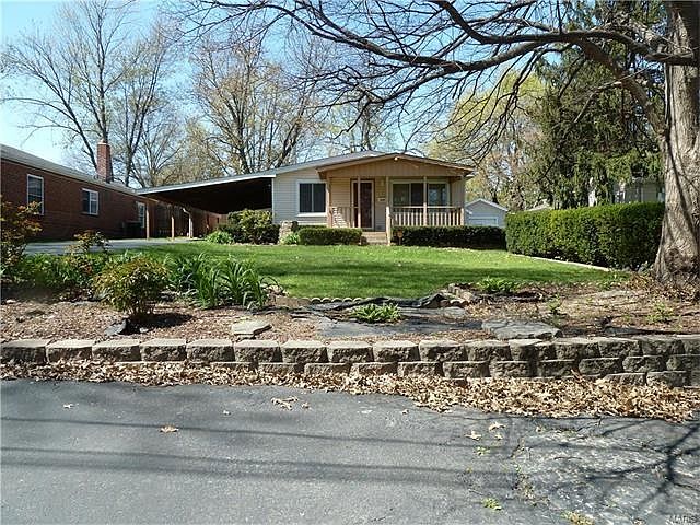 This home is is much larger than it appears in this picture. In fact it is 2384 sq. ft. Vinyl sided with a 17 x 07 covered front porch and a 2-car carport. The drive way will hold at least 2 and maybe 3 more vehicles and the asphalt area you see her is a 