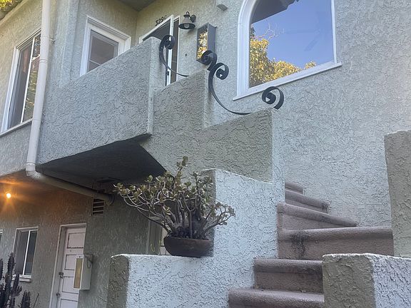 Stairs lead to apartment C
