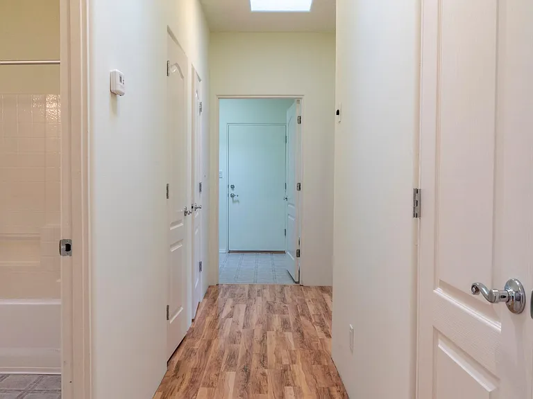 Hallway to bedroom 2 and 3, utility room