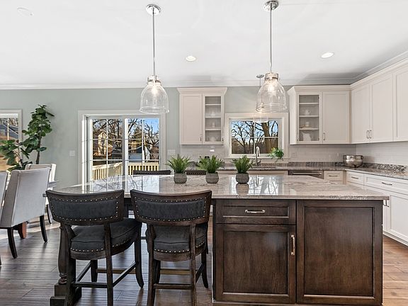 Kitchen has fabulous space and layout, cabinetry, huge island with seating and serving a crowd.