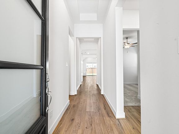Elongated foyer leads to the open-concept great room