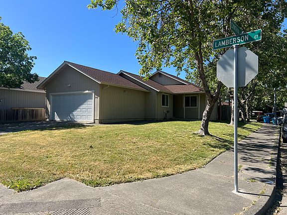Nice large corner lot landscaped front. Garage includes 220V plug for charging electric vehicles.