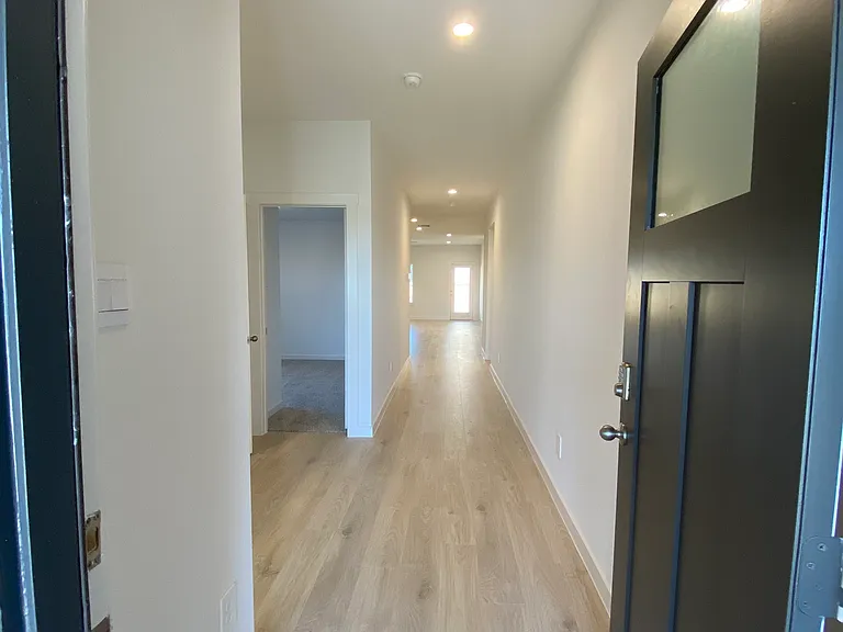 Entryway, door to guest bedroom 2 visible on left