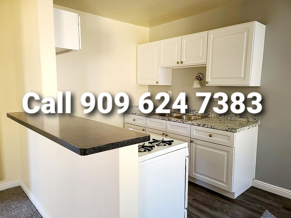 *Open-Concept Kitchen and Living Spaces with modern white custom kitchen Cabinets...