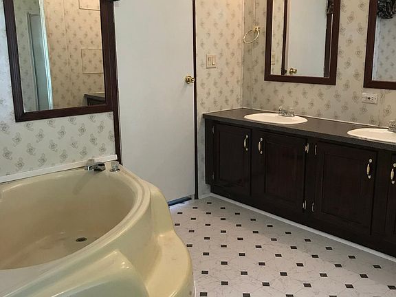 Master Bathroom with double vanity, shower and bath bub