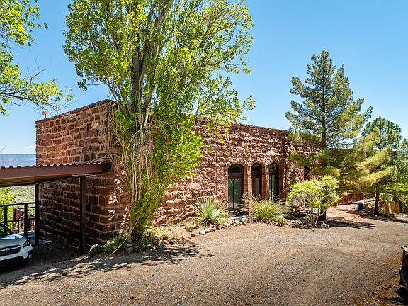 Front of historic, stone home.