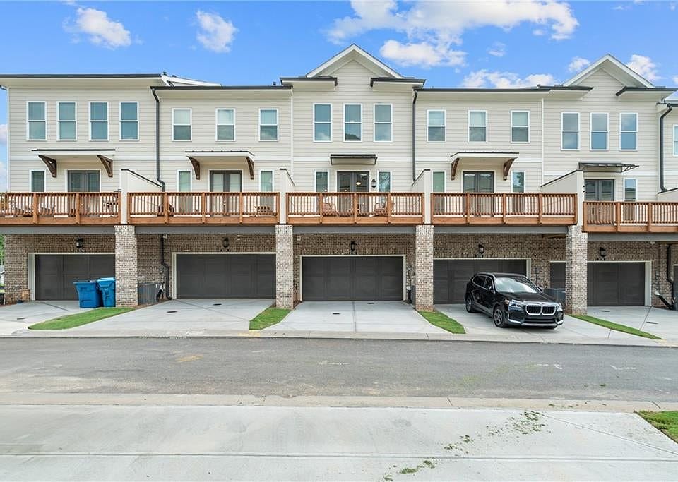Two car rear entry garage compliments this beautiful Garrison home. Photo not of actual building.