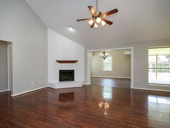 Gather the family and guests together in your lovely living room! Featuring high ceilings, recessed lighting, ceiling fan, gorgeous wood floors, stunning fireplace, and large windows that provide plenty of natural lighting throughout the day!