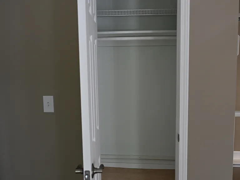 Living room/hallway closet.