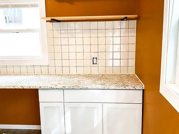 Exposed shelving in the kitchen.