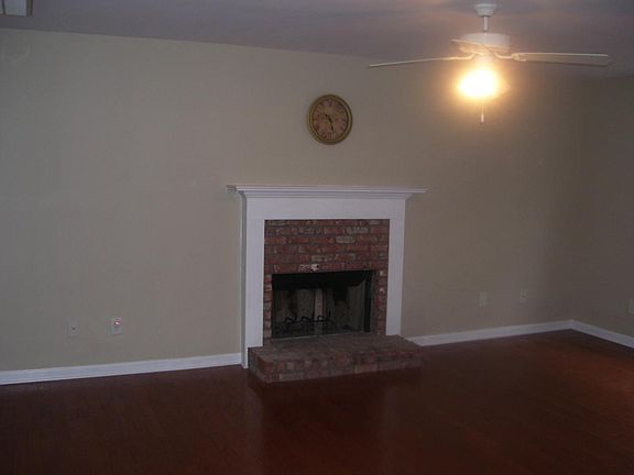 wood burning fireplace in living room