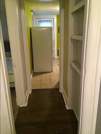 Halway into Large Bedroom and Kitchen