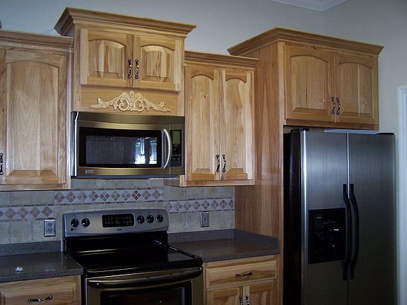 kitchen w/ Corian countertops and stainless steel appliances
