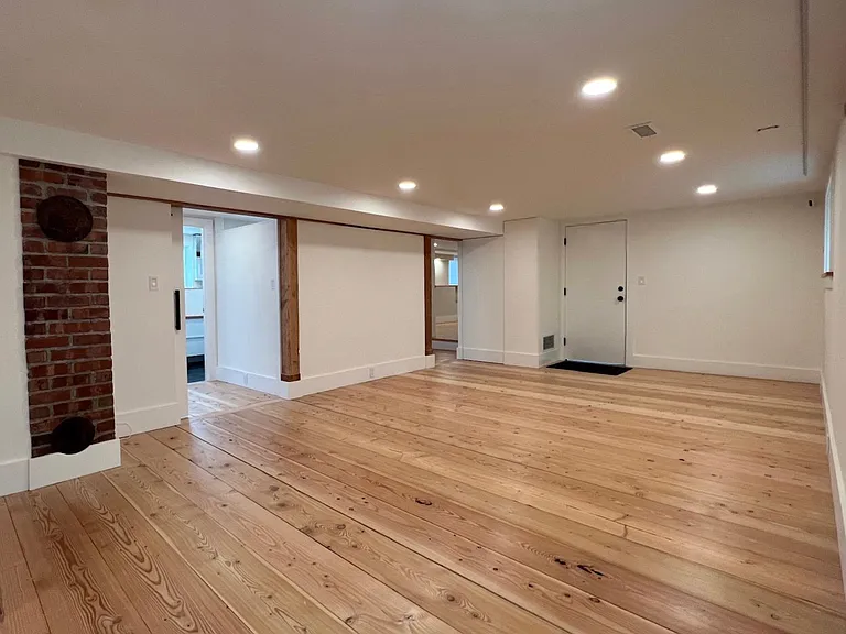 custom solid wood flooring throughout the whole floor, direct access to attached garage