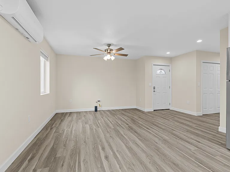 Family room and front door view from kitchen.