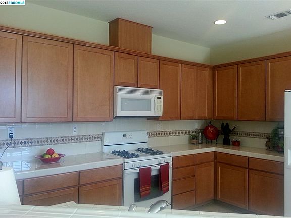 Kitchen with decorative tile counters