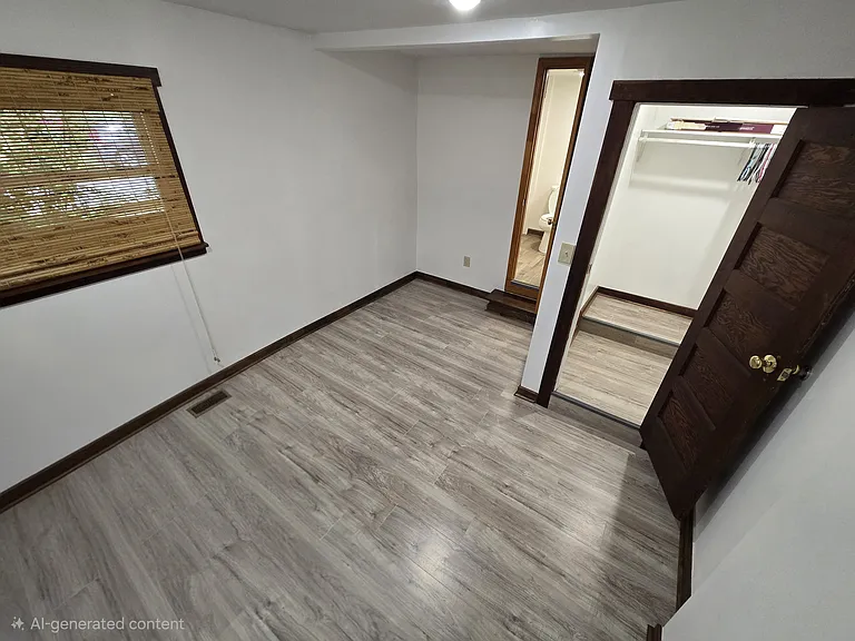 Bedroom two with walk in closet and en suite full bathroom. (Photo editing used to remove furniture in order to give a better understanding of the space.)