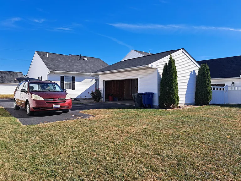 Partially fenced lawn.