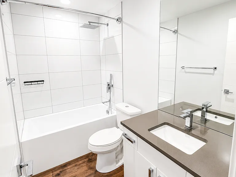 Full bathroom with tub and rainfall shower head