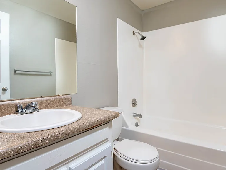 Newly Renovated Bathroom with Large Tub and Brown Counters