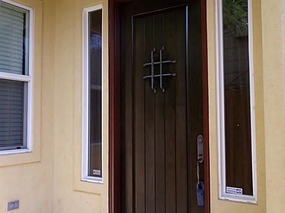 Enjoy the pretty front wood door and private covered front porch.