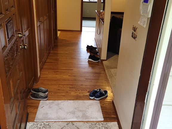 Inside entry way, with three spacious closets to the left.