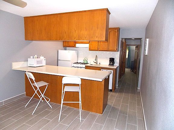 The kitchen area looking down the hallway to the bedroom.