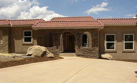 Circular driveway with covered courtyard entrance