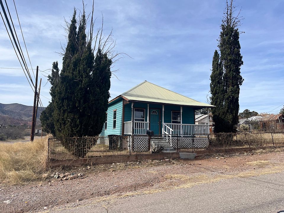 Cute Bisbee home with front porch fenced yard and plenty of off steer parking