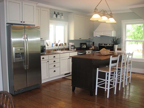 Beautiful Antique White Kitchen with Stainless Steel Appliances