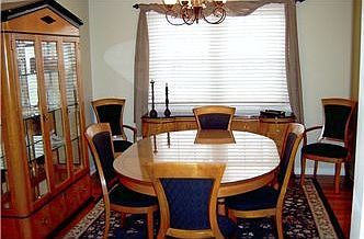 Spacious dining room with double windows