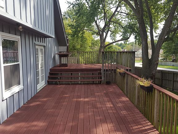Multi-tiered deck spans entire length of house