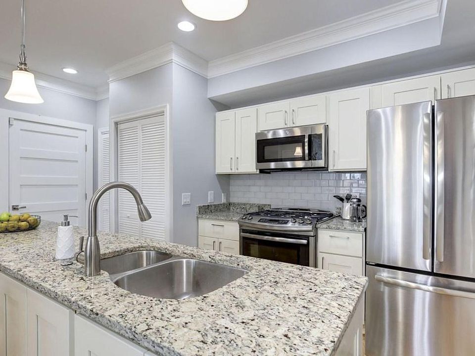 Kitchen with dishwasher, and wash and dryer unit (hidden in the closet)