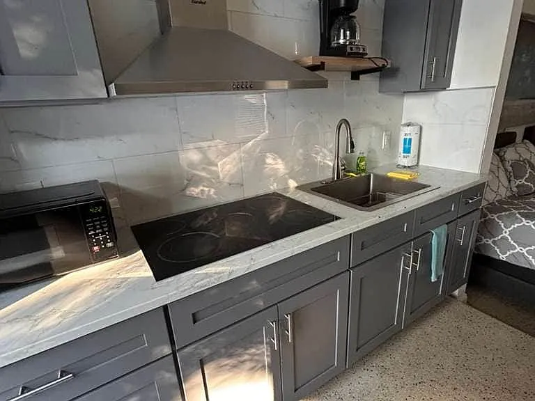 Fully equipped modern kitchen with dishwasher and essential comforts.