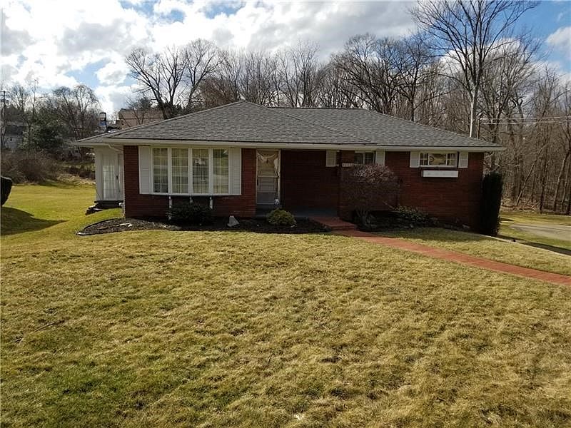 This well maintained all brick ranch sits on a large lot with great backyard space.