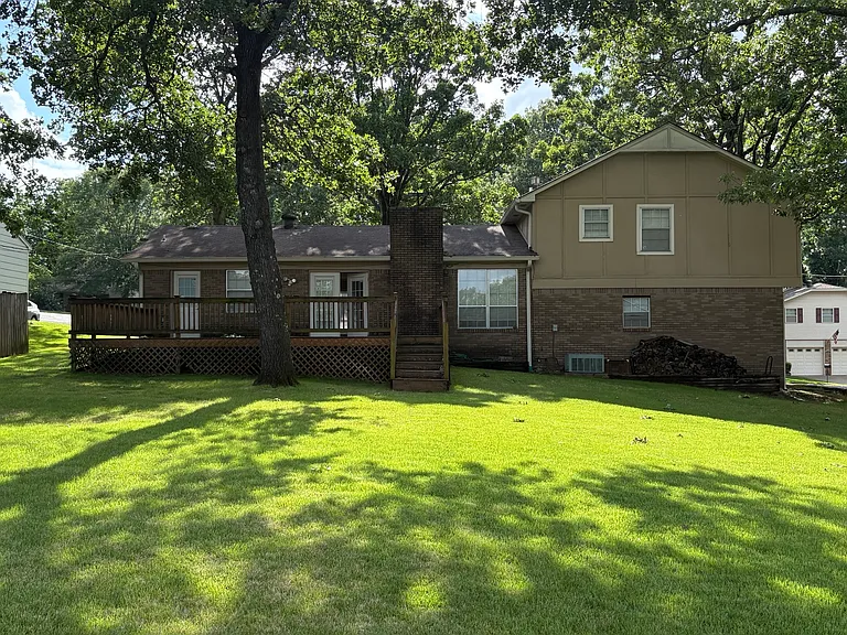 large private back yard with sun deck