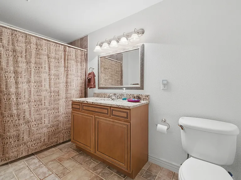 Private bathroom with tub and shower