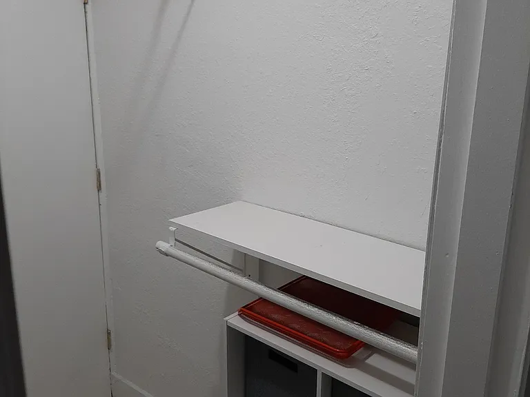 Master bedroom walk-in closet. Air conditioning access through door.