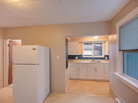 Updated kitchen with stove & fridge.