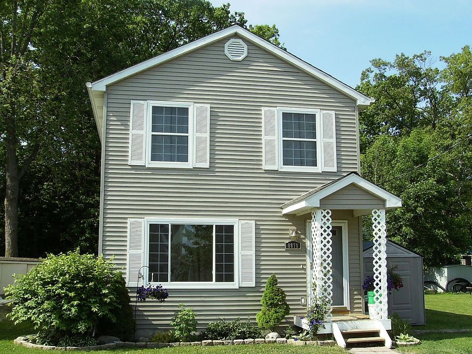 Front of house faces lake