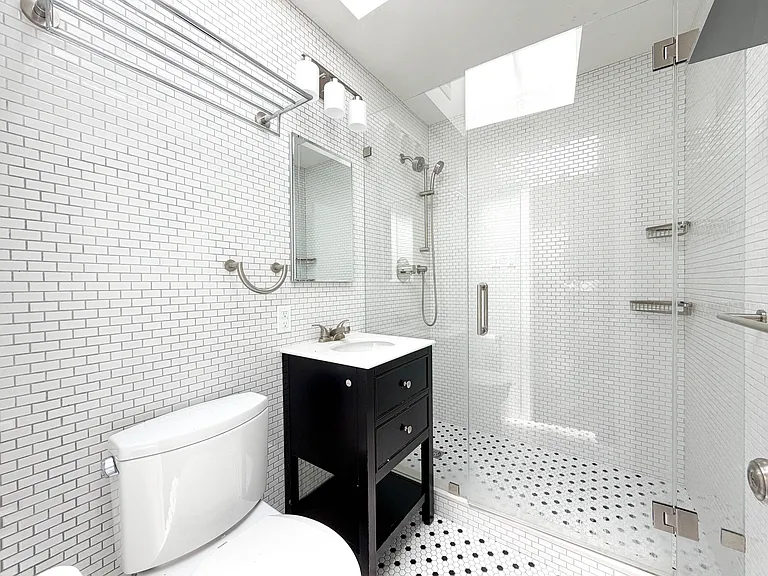 Renovated bathroom with skylight