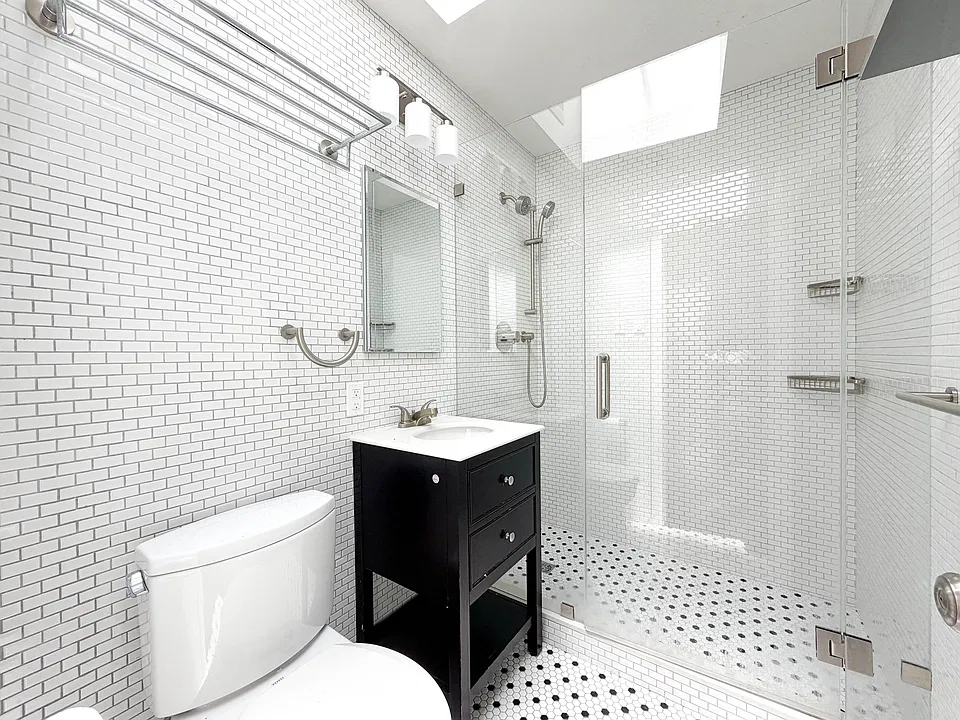 Renovated bathroom with skylight