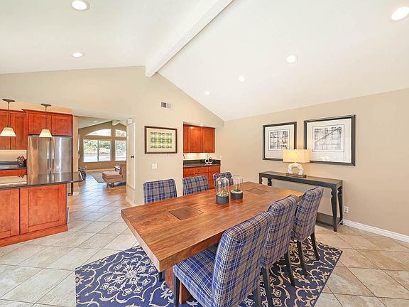 Dining room with kitchen on the left and access to living room