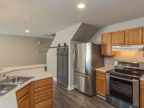 Sliding barn door hides extra storage