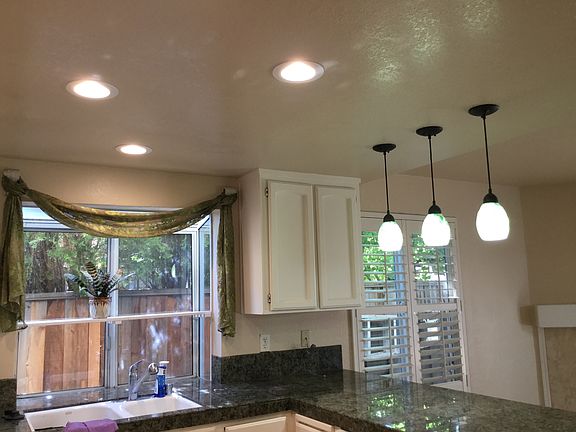 Newly renovated kitchen recessed LED lights and pendants