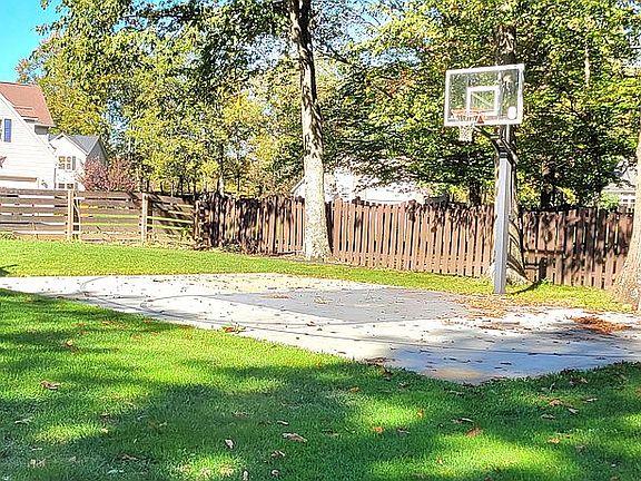 Basketball court fenced yard