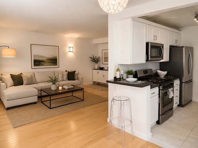 Living room off kitchen. Can place a barstool off kitchen