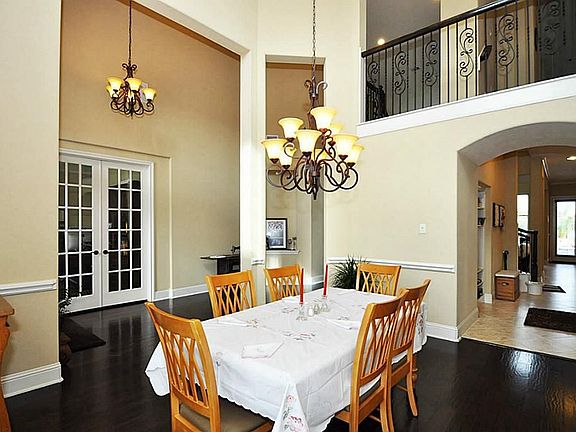 Open concept formal dining room with high ceilings